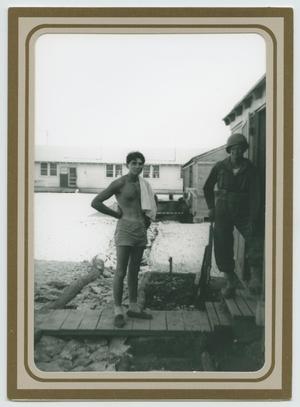 Primary view of object titled '[Nick Morgillo and Charles Thomas Standing Outside of a Hutment]'.