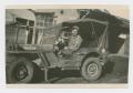 Photograph: [Soldiers Sitting in a Jeep]