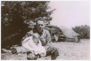 Primary view of object titled '[First Sergeant Halard Eubanks Holding His Child]'.