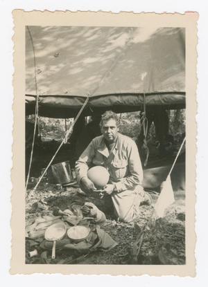Primary view of object titled '[Nathan Levine Resting Outside Evacuation Station]'.