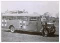 Photograph: [George Ayers with Captured German Bus]