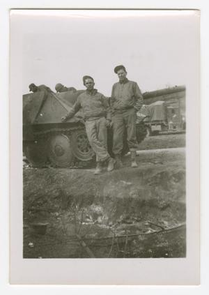 [W. B. Cummings and Herbert Franks Standing with a German Tank]