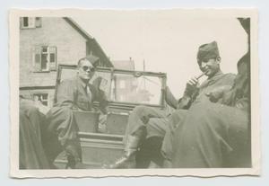 Primary view of object titled '[Freddie Meuman and Leonard Machalow in a Jeep]'.