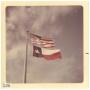 Photograph: [American and Texas flags]