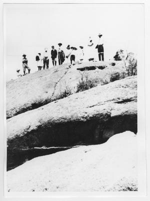 [Group of People on a Rock]