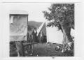 Photograph: [People Near a Tent]