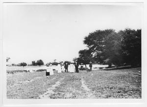 [Photograph of Group of People Near a Pond]