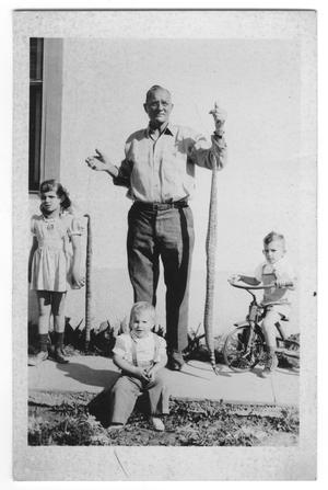 Primary view of object titled '[Photograph of Charley Bishop and grandchildren]'.