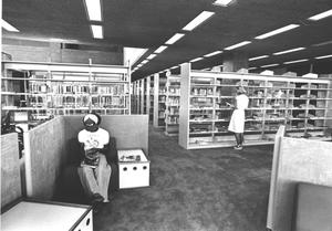 [Library Shelves and Students]