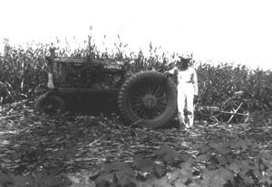 [Gunnar Rydell with tractor in field]