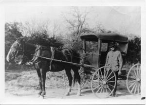 [Mr. Prewitt with horse drawn mail buggy]