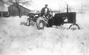 Primary view of object titled '[Man plowing snow with tractor]'.