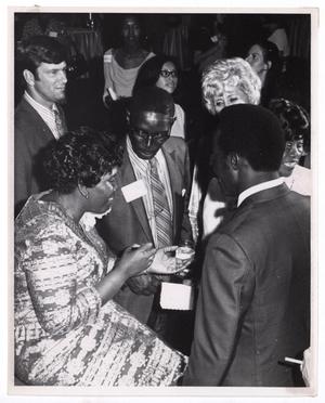 Primary view of object titled '[Barbara Jordan Surrounded by Guests]'.