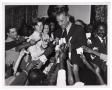 Photograph: [Lyndon B. Johnson Signing Autographs]
