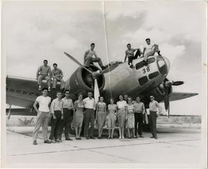[Photograph of Group with WWII Bomber]