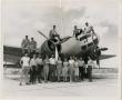 Photograph: [Photograph of Group with WWII Bomber]