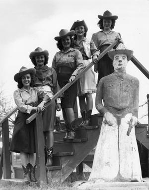 Primary view of object titled '[Photograph of Cowgirl Band in Front of Statue]'.