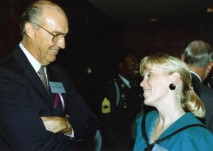 [Photograph of Dr. Fletcher Speaking to Woman at HSU Event]