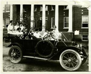 [Photograph of Ford Model A and Students]