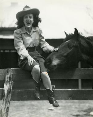[Photograph of HSU Cowgirl with Horse]