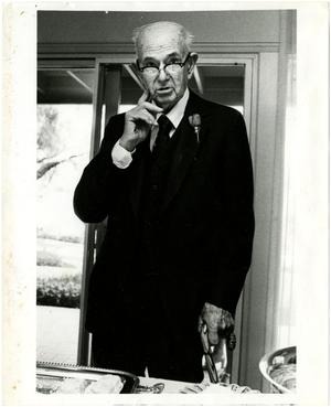 [Photograph of Dr. Richardson at Buffet Table]