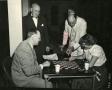 Photograph: [Photograph of Group Playing Checkers]