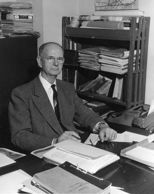 [Photograph of Dr. Richardson at His Desk]