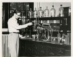 [Photograph of Student in Chemistry Lab]