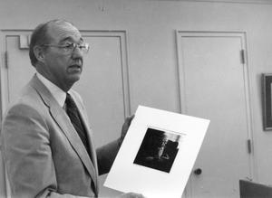 [Photograph of Dr. Fletcher with Picture]