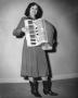 Photograph: [Photograph of Cowgirl Playing Accordion]