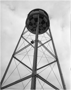 R.D. Reese replacing bulb on water tower