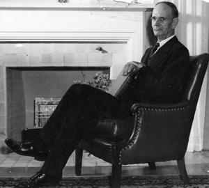 [Photograph of Dr. Richardson in Front of Fireplace]