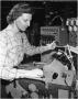 Primary view of Gladys Brogdon at work in Engineering Test Lab