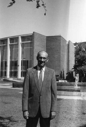 Primary view of object titled '[Photograph of Jesse C. Fletcher in Front of Behrens Auditorium]'.