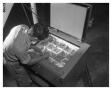 Photograph: D.F. Grimes removing rivets from the ice box