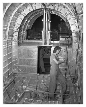 [Female Working in Bomber Tail Fuselage]
