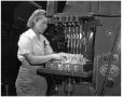 Photograph: [Woman Working with Machinery]
