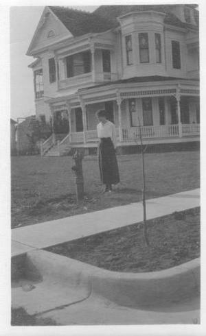 [Josephine Rich looking at a fire hydrant.]