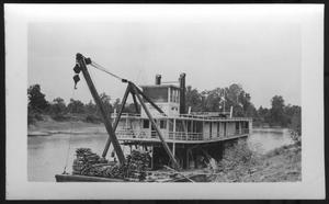 [Boat near the bank of a river. Location unknown.]