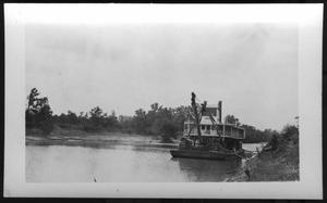 [A Boat Located Close to River Bank. Location Unknown.]