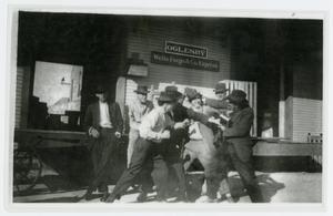 [Men Roughhousing in Front of a Wells Fargo Building]