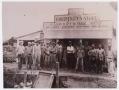 Photograph: [Men Standing in Front of Courtney's Store]
