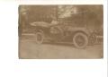 Primary view of [Man in Pierce-Arrow automobile]