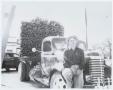 Photograph: [Man on Log Truck]