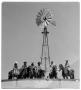 Photograph: Cowboys near an Axtell Windmill