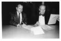 Photograph: Wheeler and Ensminger sing Historic Agreement