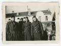 Photograph: [Four Soldiers Standing by a Car]