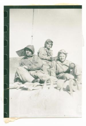 [Three Soldiers Sitting Atop a Tank]