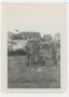 Photograph: [Seven Soldiers and Two Tanks by German Houses]