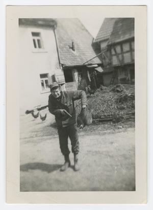 [William Giannopoulos Holding a Pistol and a Chicken]